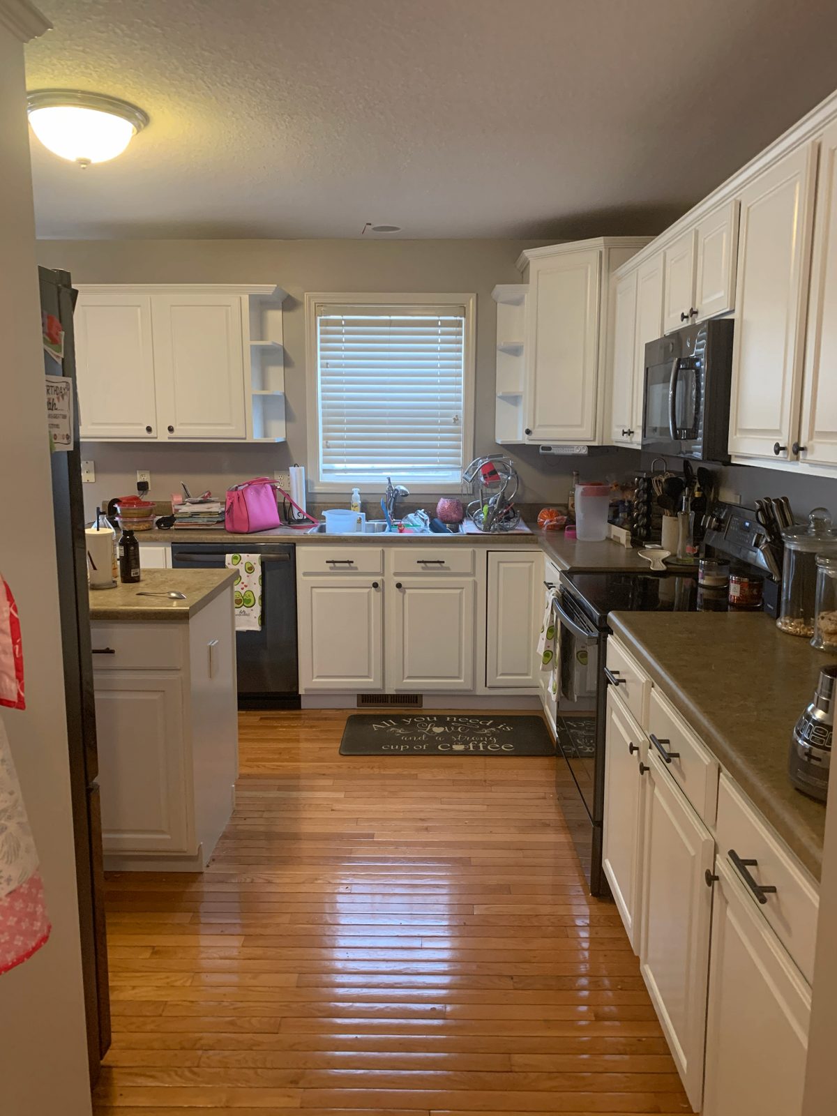 Kitchen cabinets refinished in soft white satin with new hardware