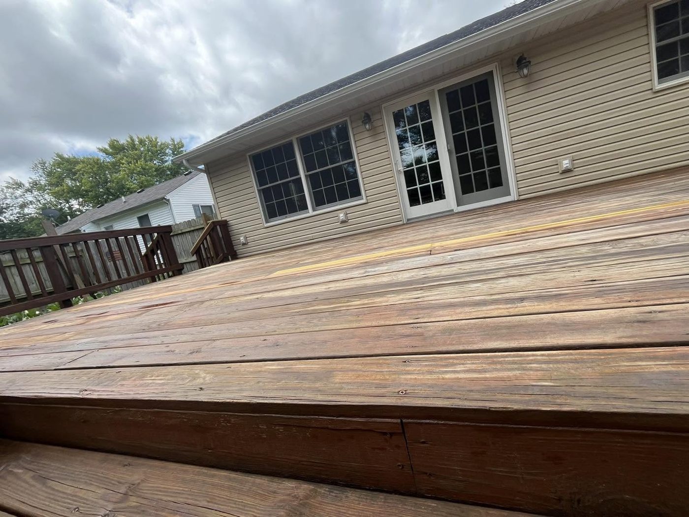 Weathered deck boards before restoration