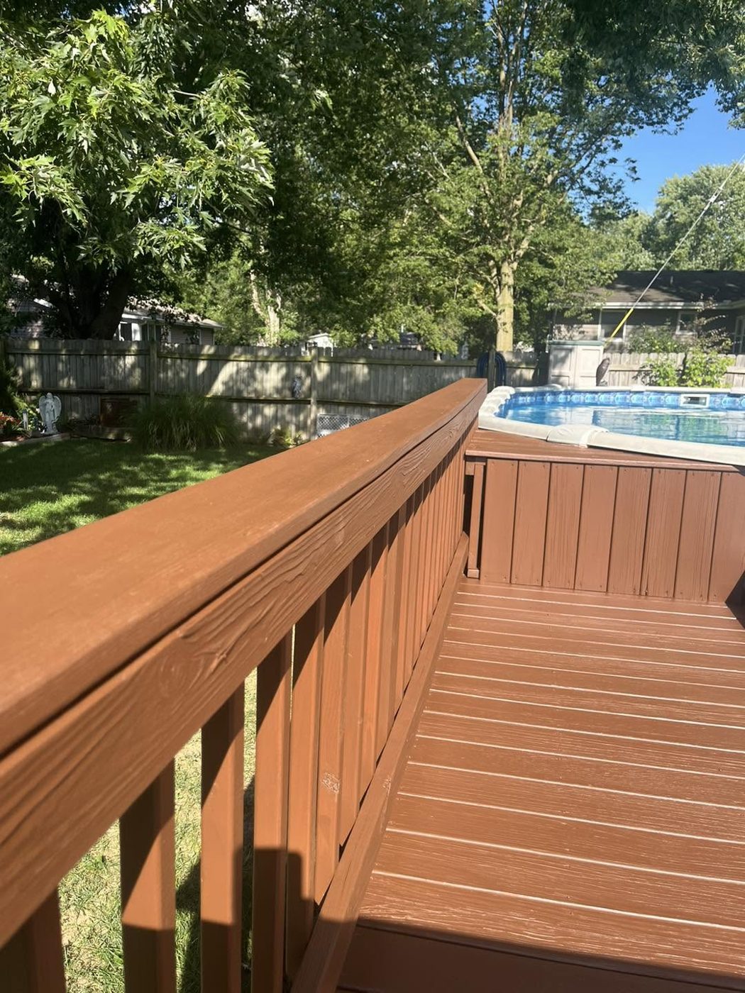 Stained railing overlooking the pool